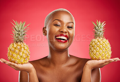 Buy stock photo Beauty, pineapple and portrait of a woman in studio for healthy food, diet or fruit. Black person with makeup on red background for face glow, natural cosmetics and tropical skin care or wellness