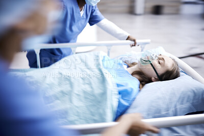 Buy stock photo Hospital, bed and patient with surgeon running in surgery, emergency and support for healthcare service. Theatre, doctors and sick child with medical people or nurses in speed for crisis and problem