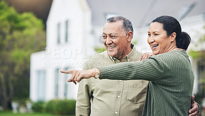 Buy stock photo Happy, pointing and a senior couple in nature for a holiday, travel or break in retirement. Smile, love and an elderly man and woman with a gesture in a backyard or neighborhood lawn for the view