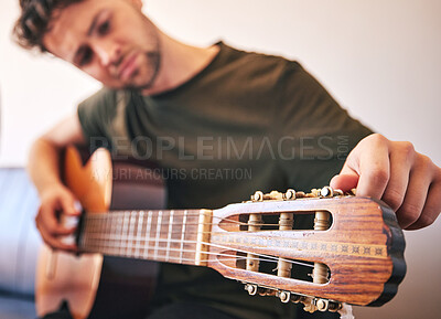 Buy stock photo Closeup, man and tuning guitar for music, talent and creative skill of sound production in home studio. Hands, musician and singer check notes of acoustic instrument for audio, performance and artist