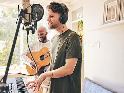 Buy stock photo Microphone, guitar and friends singing with piano in home studio together. Electric keyboard, acoustic instrument and recording band, creative music production and men live streaming on headphones.