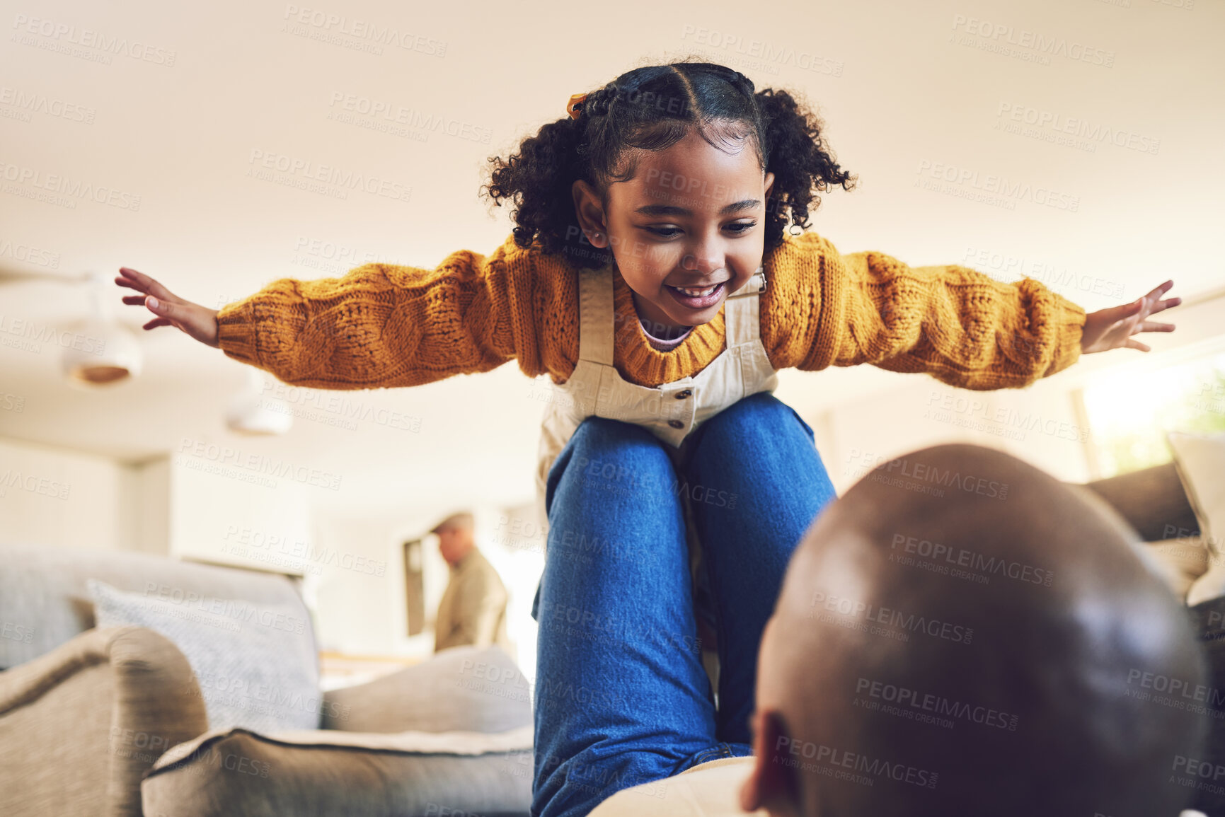Buy stock photo Young girl, father and playing, airplane and flying with freedom, bonding and happiness at home. People in living room, family house and relax, care free and playful with games, fun and man with kid