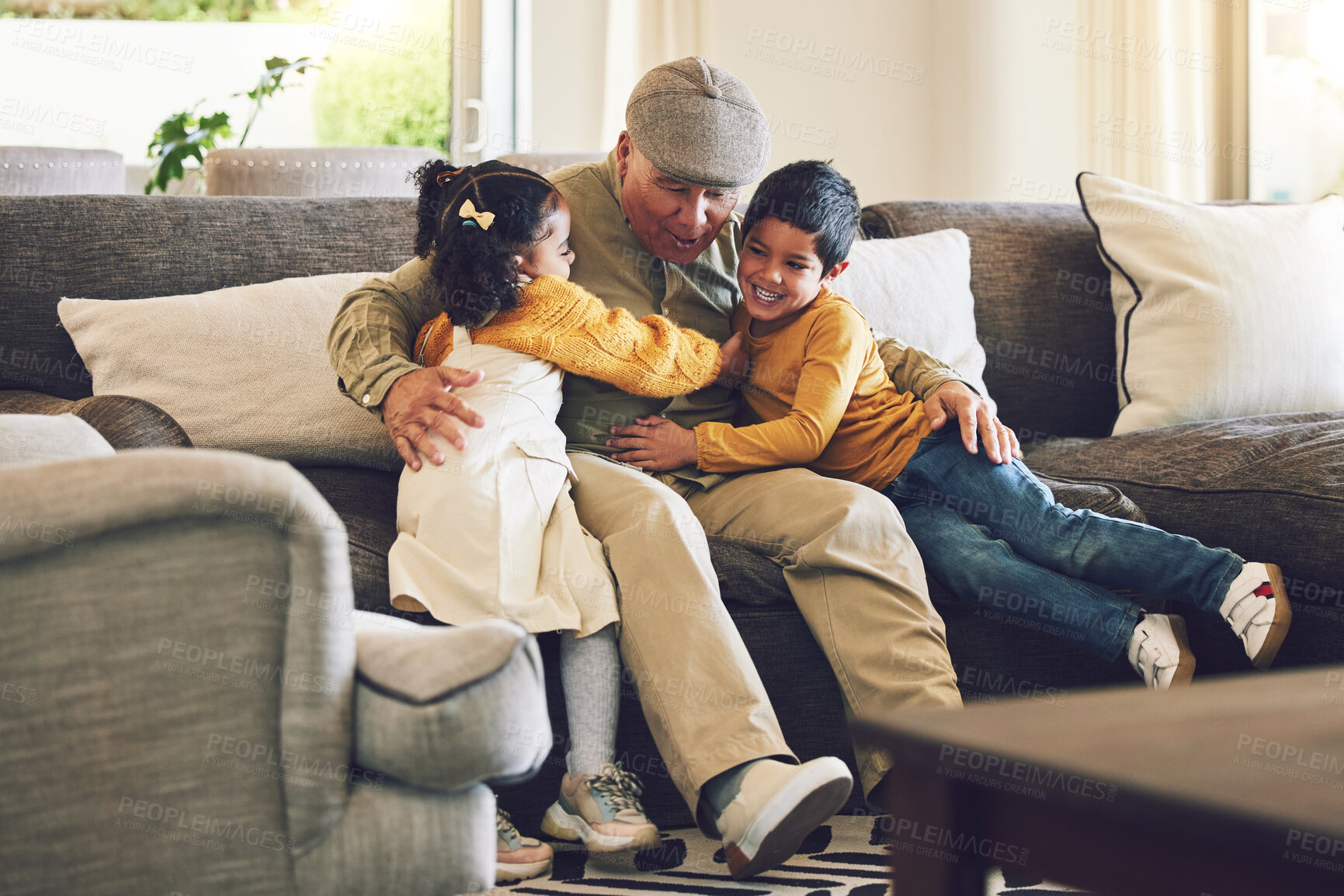 Buy stock photo Hug, grandfather or happy kids on a sofa with love enjoying quality bonding time together in family home. Smile, affection or senior grandparent relaxing with young children siblings on house couch 