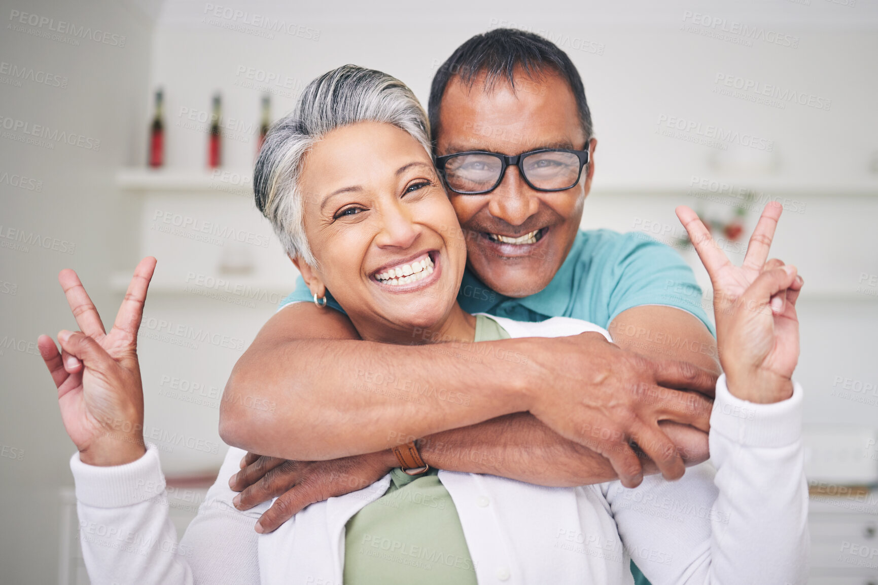 Buy stock photo Peace sign, love and smile with portrait of old couple for support, happy and relax. Happiness, kindness and peace with senior man and woman hugging at home for embrace, trust and retirement