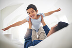 Airplane, portrait and boy child with father on a bed with love, bonding and having fun with game at home. Flying, playing and face of kid smile with parent in a bedroom with fantasy, plane or lift