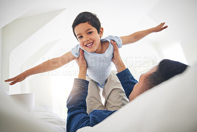 Buy stock photo Airplane, portrait and boy child with father on a bed with love, bonding and having fun with game at home. Flying, playing and face of kid smile with parent in a bedroom with fantasy, plane or lift