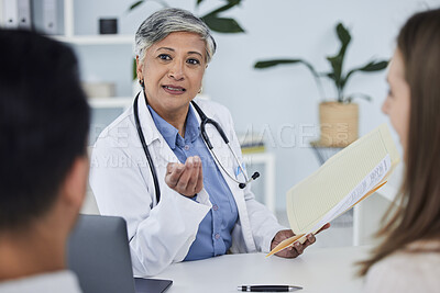 Buy stock photo Senior woman, doctor and couple for life insurance, consultation or healthcare advice at the hospital. Happy mature female person or medical professional in meeting, discussion or consulting patients