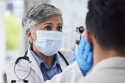Buy stock photo Woman, doctor and face mask with patient for exam, checkup or healthcare appointment at hospital. Female person or medical professional with protection checking ill or sick man with flu at clinic 