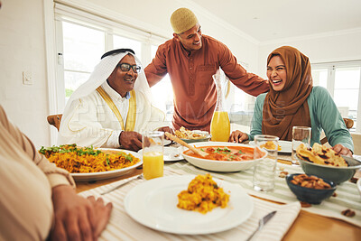 Buy stock photo Food, lunch and muslim with big family at table for eid mubarak, Islamic celebration and happy. Ramadan festival, culture and iftar with people eating at home for fasting, islam and religion holiday