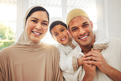 Buy stock photo Portrait, hug and happy muslim family of mother, father and child smile, bond and enjoy quality time together. Living room, home happiness and face of Islamic mom, kid and Arabic dad embrace for love