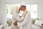Home, Muslim or senior couple kiss, slow dance and bond for love, trust and care in retirement, support or marriage. Romance, Islamic or Arab man, woman and elderly people together for quality time