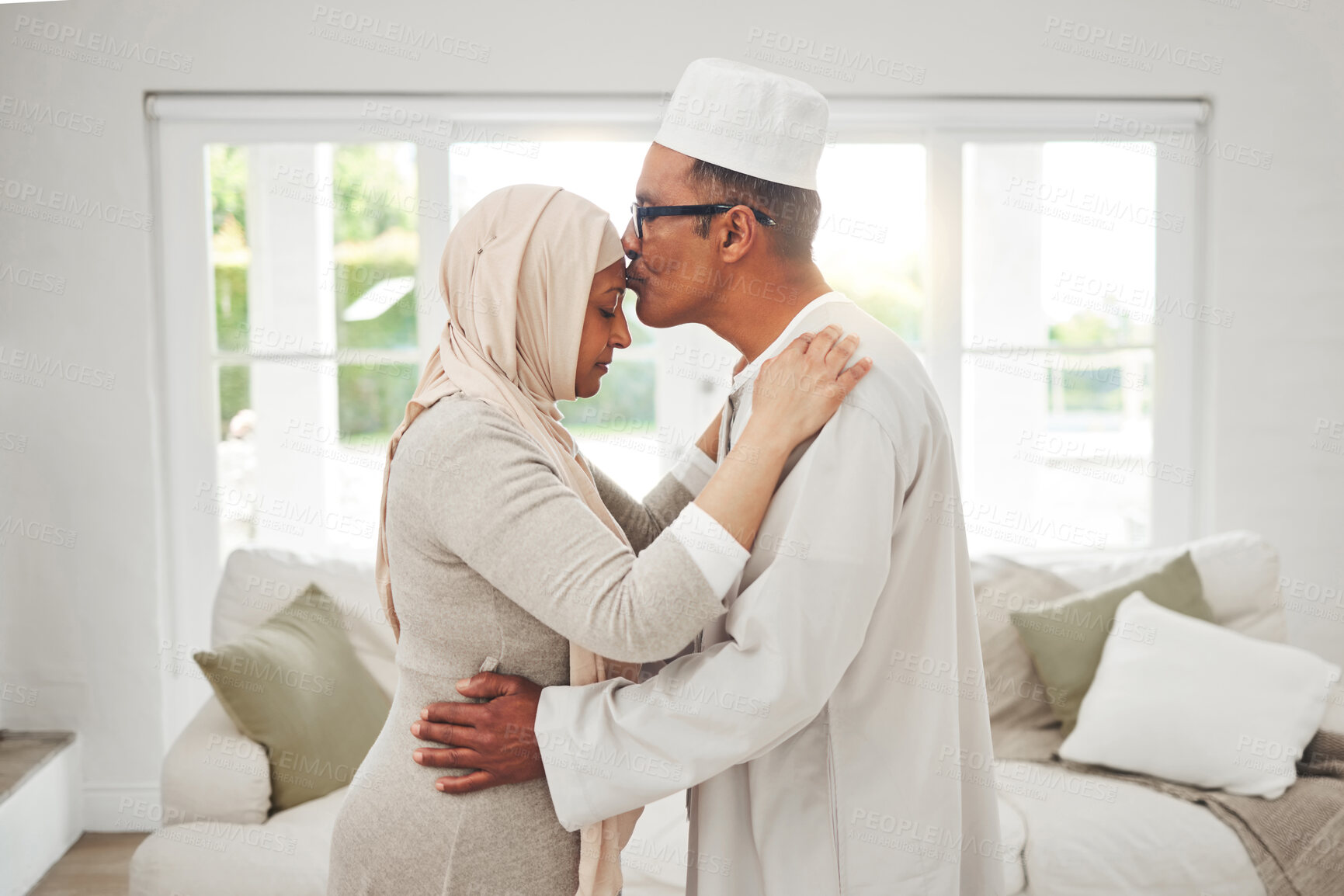 Buy stock photo Home, Muslim or senior couple kiss, slow dance and bond for love, trust and care in retirement, support or marriage. Romance, Islamic or Arab man, woman and elderly people together for quality time