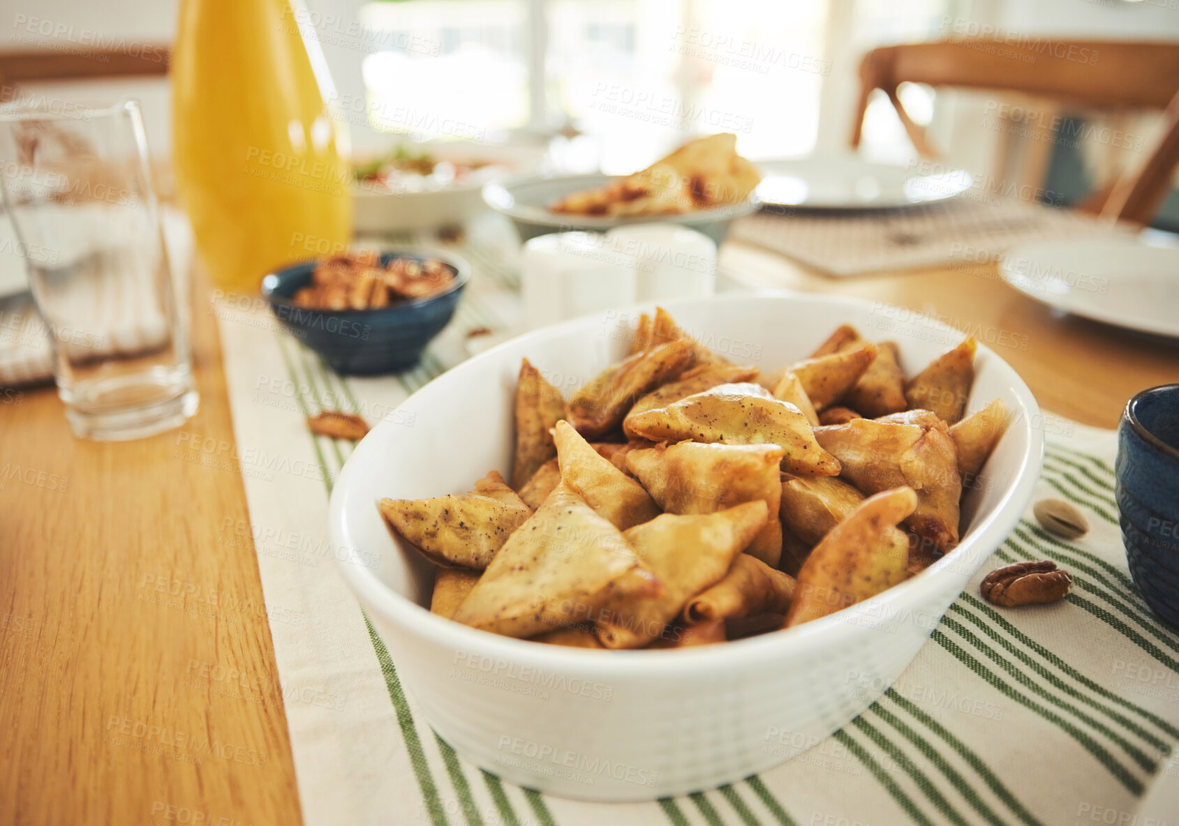 Buy stock photo Food, Eid Mubarak and samosa for family at table for Islamic celebration, festival and lunch together. Ramadan, religion and closeup of meal, dish and cuisine for fasting end, holiday and culture