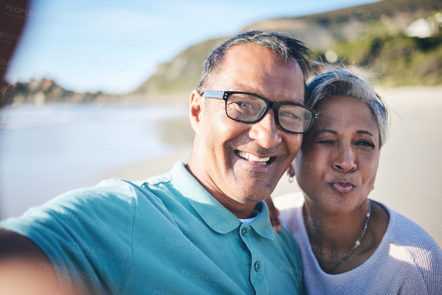 Buy stock photo Senior couple, beach selfie and portrait with smile, pouting lips and happy for vacation, summer and memory. Mature man, woman and outdoor with photography, profile picture and ocean for social media