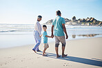 Beach, walking and senior couple with child for bonding, quality time and relaxing in nature. Family, retirement and happy elderly man and woman with boy by ocean on holiday, vacation and travel