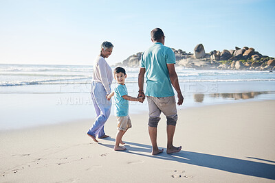 Buy stock photo Beach, walking and grandparents holding hands with child for bonding, quality time and relax in nature. Family, retirement and happy elderly man and woman with boy on holiday, vacation and travel
