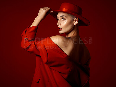 Buy stock photo Back, vision and fashion with a woman on a red studio background for elegant or trendy style. Future, art and beauty with a young female model thinking while looking edgy or classy in a unique suit