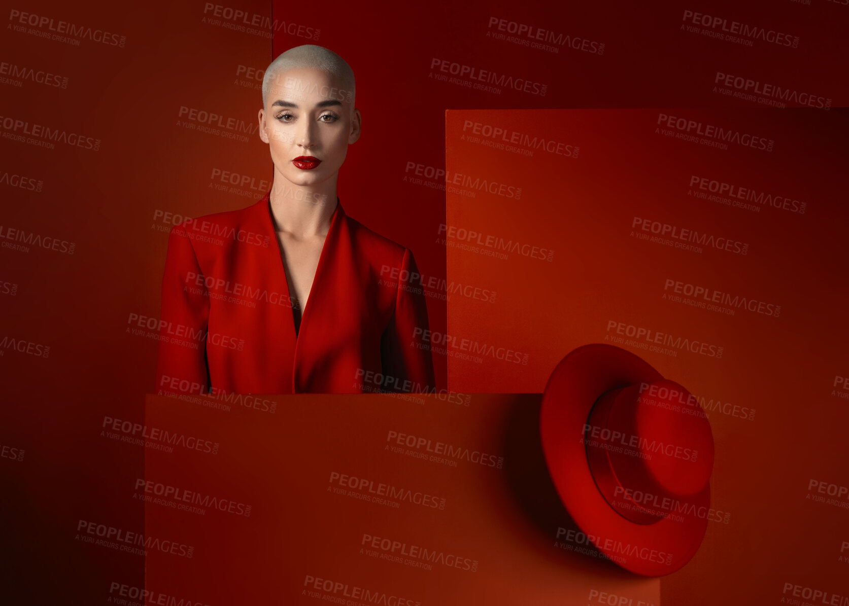Buy stock photo Fashion, portrait and a bald woman on a red background for cosmetics, sexy or vintage aesthetic. Serious, luxury and a young model or girl branding or advertising makeup isolated on a studio backdrop