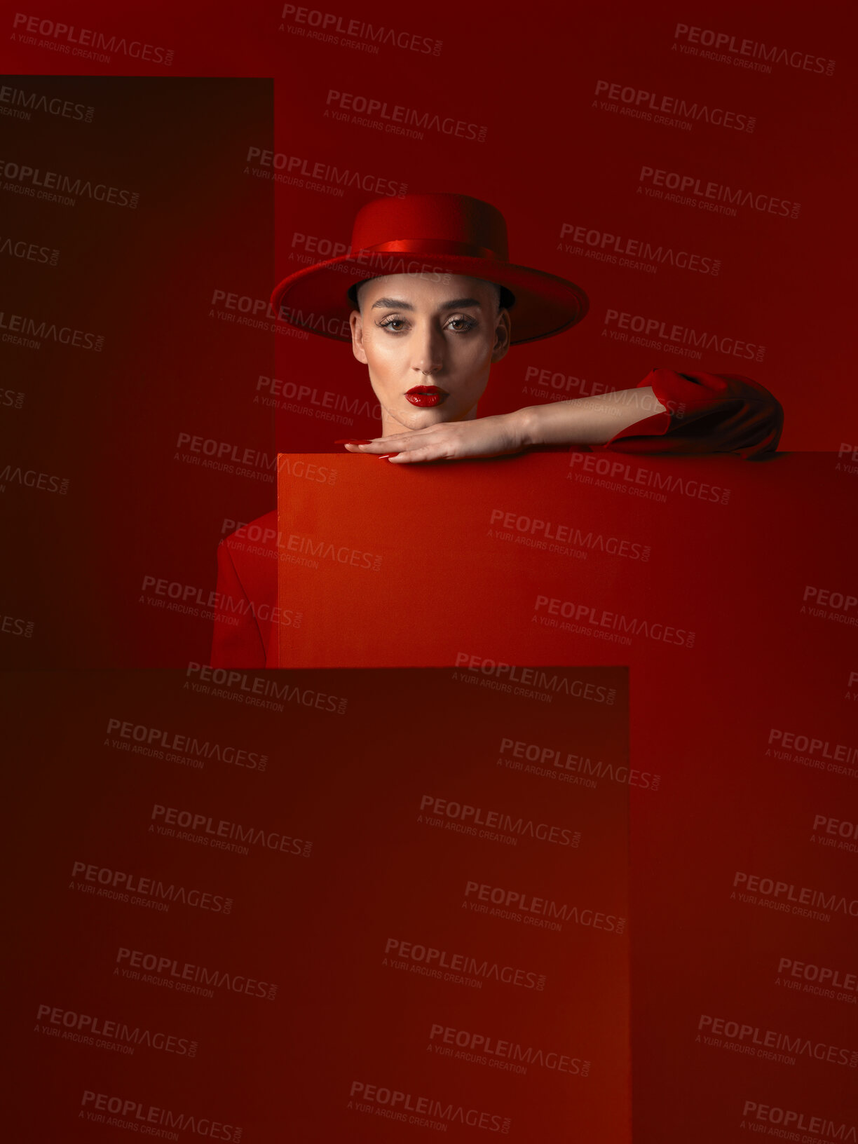 Buy stock photo Portrait, fashion and space with a woman on a red studio background for marketing, advertising or branding. Luxury, aesthetic style or a trendy young female model standing with empty or blank space