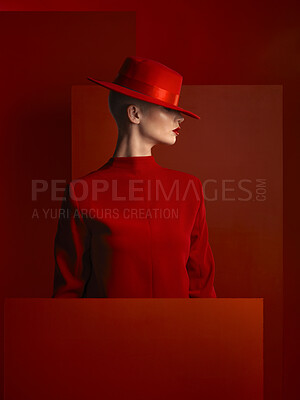 Buy stock photo Profile, fashion and mockup with a woman on a red background in studio for marketing, advertising or branding. Luxury, aesthetic style or trendy young female model standing with space for a logo
