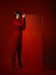 Fashion, makeup and portrait of woman with red board, futuristic art and unique studio background. Future aesthetic, mockup and creative beauty, body of model in dark luxury designer brand mockup.