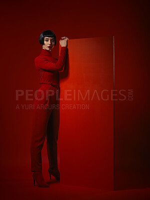 Buy stock photo Fashion, makeup and portrait of woman with red board, futuristic art and unique studio background. Future aesthetic, mockup and creative beauty, body of model in dark luxury designer brand mockup.