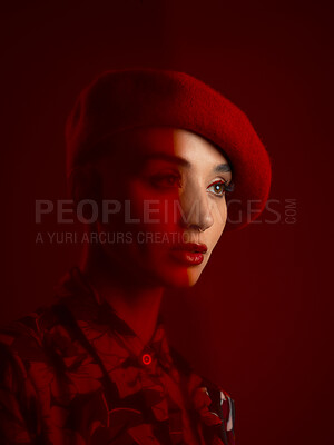 Buy stock photo Woman, fashion and face with red aesthetic, beauty and makeup with vintage hat isolated on studio background. Retro style, female model with serious expression and cosmetics, attractive and bold