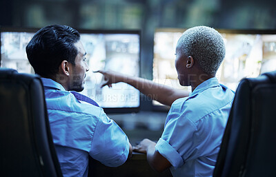 Buy stock photo Security guard in control room, man and woman with screen to check cctv together in team office. Safety, surveillance and teamwork, video to monitor crime and privacy at night for protection service.