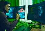 Cybersecurity, crime and happy man programming in neon office with code, fraud and hacking with hoodie. Software, ransomware and hacker on cyber attack, password thief coding online scam and success.