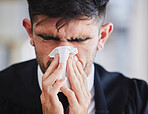 Sick business man, tissue and blowing nose for allergies, cold and virus in office. Face of male employee sneeze with influenza, allergy bacteria and risk of health problem, sinusitis and infection