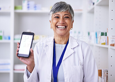 Buy stock photo Portrait, mockup phone and a woman at a pharmacy for medical service, healthcare and showing an app. Smile, contact and a mature pharmacist with a blank mobile screen advertising medicine or advice