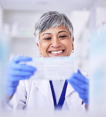 Buy stock photo Pharmacist, mature woman and medicine box for prescription at pharmacy with blurry background. Healthcare, drugstore and pharmaceutical worker holding tablet or treatment in closeup at clinic.
