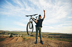 Hand sign, mountain bike and man outdoor in nature for extreme sports, training or workout. Rock on, cool attitude and male person with bicycle for off road cycling, countryside travel or adventure