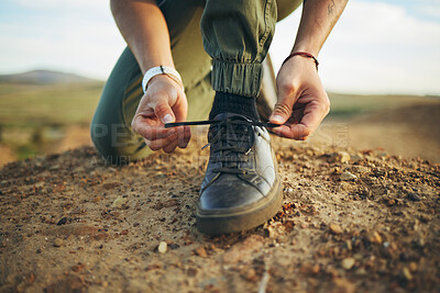 Buy stock photo Hands, tie shoes and hiking in nature for travel, training or adventure outdoor. Fitness, sports and person tying laces on sneakers to start workout, walk or running, cardio or workout in countryside