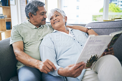 Buy stock photo Couple, relax and reading book together on sofa in living room with love, care and quality time. Senior man, happy woman and married partner enjoy discussion with books on couch at home in retirement