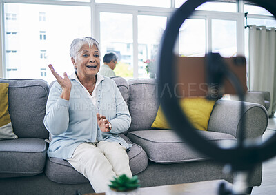 Buy stock photo Mature woman, live stream and broadcast in home on social media, online vlog or communication to virtual audience. Lady, content creator or filming digital podcast in lounge with phone, light or blog
