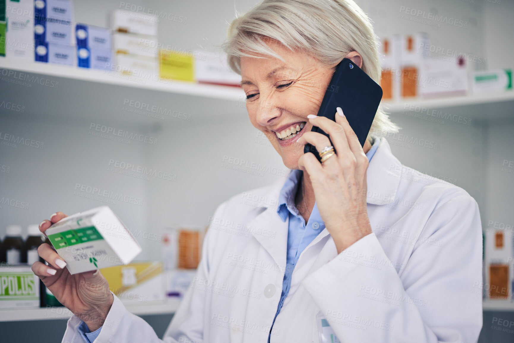 Buy stock photo Happy woman, pharmacist and phone call with medication for telehealth, communication or advice at pharmacy. Female person, medical or healthcare expert talking on smartphone for online consultation