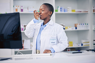 Buy stock photo Black woman, pharmacist and asthma inhaler for relief, breathing or cure at the pharmacy. Calm African female person in medical healthcare with chest pain, lungs or allergy taking deep breath in pump