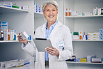 Senior woman, pharmacist stock and tablet portrait with medical work and digital information. Pharmacy, healthcare store and pills with elderly female employee with a smile with pills information 