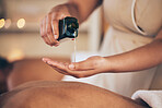 Masseuse, hands and oil for back massage, relax or lubricant in salon or spa treatment at resort. Closeup of female person pouring liquid for body care, physical therapy or healing in zen at hotel