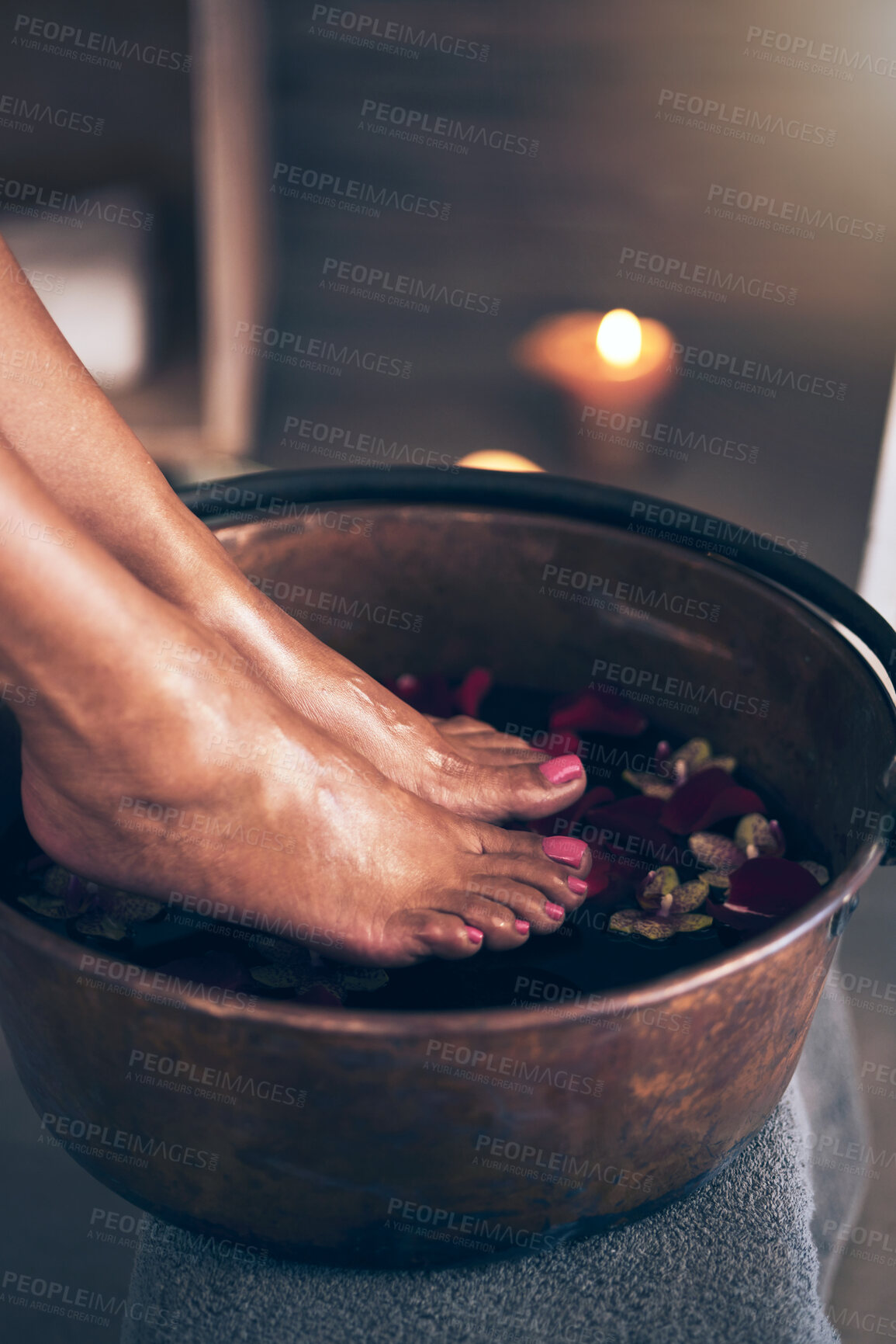 Buy stock photo Spa, health and woman feet in water to soak with flowers for a luxury, glamour and pedicure treatment. Wellness, beauty and closeup of female person relaxing for a zen self care routine at calm salon