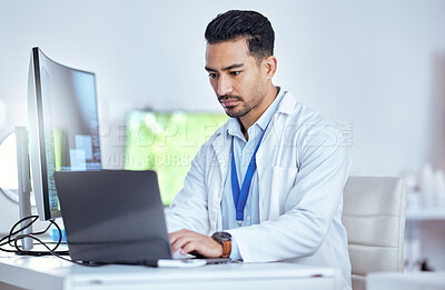 Buy stock photo Scientist, serious man and working laptop in laboratory for medical research, innovation and data analysis. Asian male researcher focus on computer for digital test, biotechnology and science report