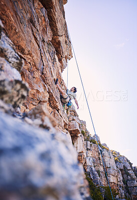 Buy stock photo Rock climbing, fitness and sports with man in nature for mountains, explore and adventure. Health, exercise and travel with person training on cliff for rope, challenge and performance mockup