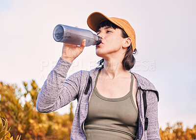 Buy stock photo Thinking, sports and woman drinking water in nature for wellness, health and after training. Hydration, idea and an athlete with a bottle to drink after running, workout or cardio on the mountain