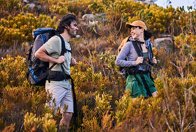 Buy stock photo Hiking, travel and couple walking on mountain for adventure, holiday and journey in nature. Travel, dating and happy man and woman talking and explore, trekking and backpacking outdoors for wellness