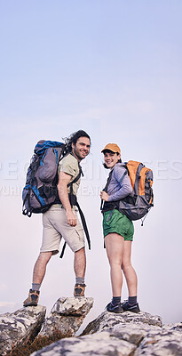Buy stock photo Mountain, hiking and portrait of man with woman on peak for adventure in nature, rock climbing and travel. Outdoor trekking, happy couple on cliff and relax in mockup space for journey with backpack.