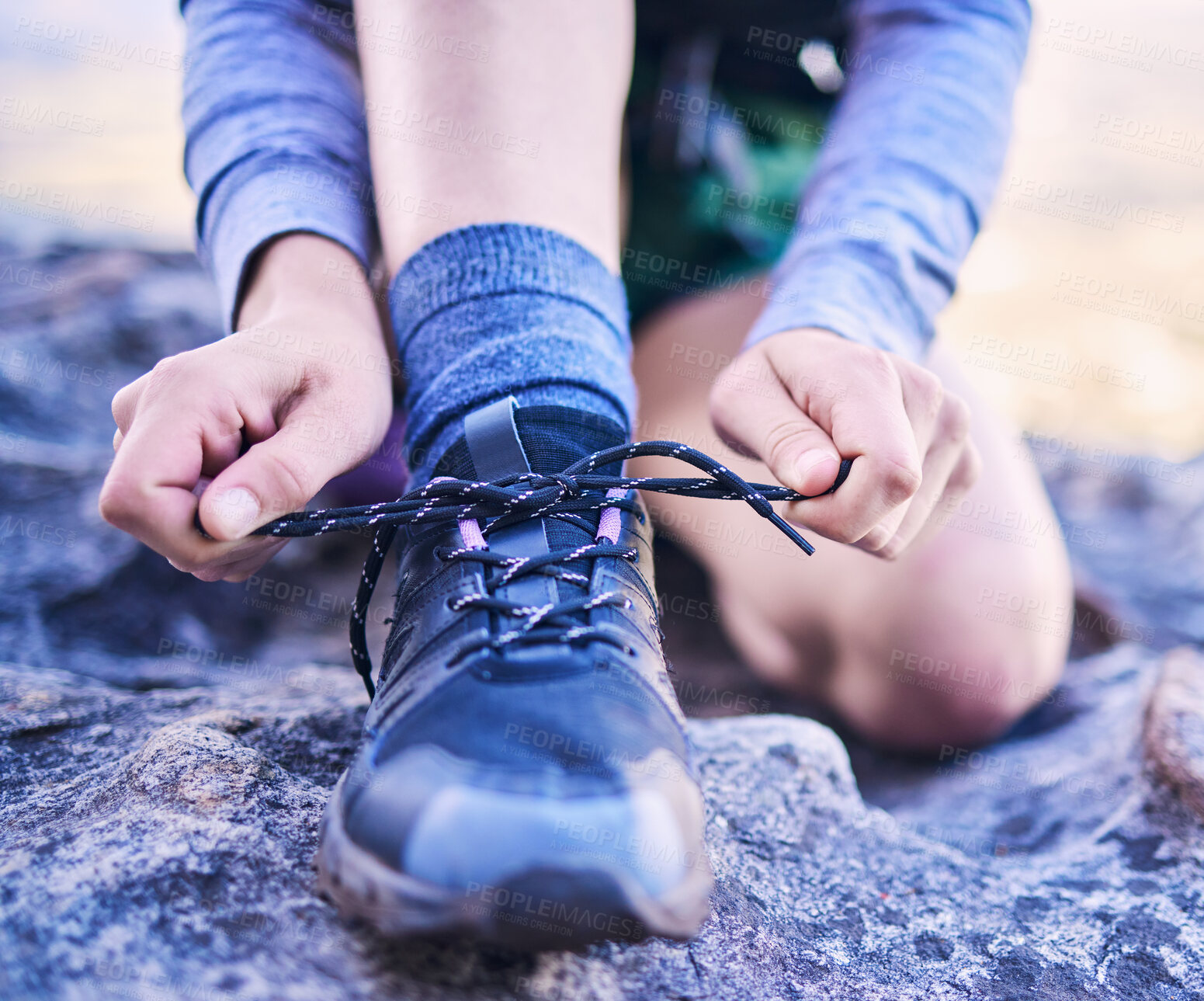 Buy stock photo Shoes, tying laces and a person for fitness, mountain hiking or start training for sports. Nature, exercise and closeup hands of an athlete with feet and ready for running, workout or cardio