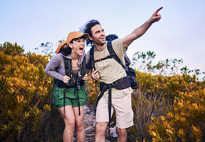 Buy stock photo Hiking, pointing and excited couple in nature for adventure, holiday and journey on mountain. Travel, dating and man and woman walking with surprise and wow for view, trekking and backpacking outdoor
