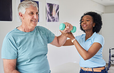 Buy stock photo Black woman, help and senior man with dumbbells with training or workout at clinic. Physical therapist, patient and nurse with equipment in nursing home for wellness with smile for rehabilitation.