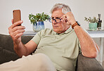 Phone, glasses and senior man reading a text message, blog or online news on a sofa in the living room. Vision, technology and elderly male person squinting while networking on a cellphone at home.